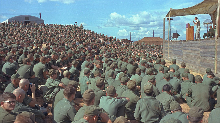 Billy Graham speaks a crowd of more than 5,000 U.S. troops at Long Binh, Vietnam, December 23, 1966.